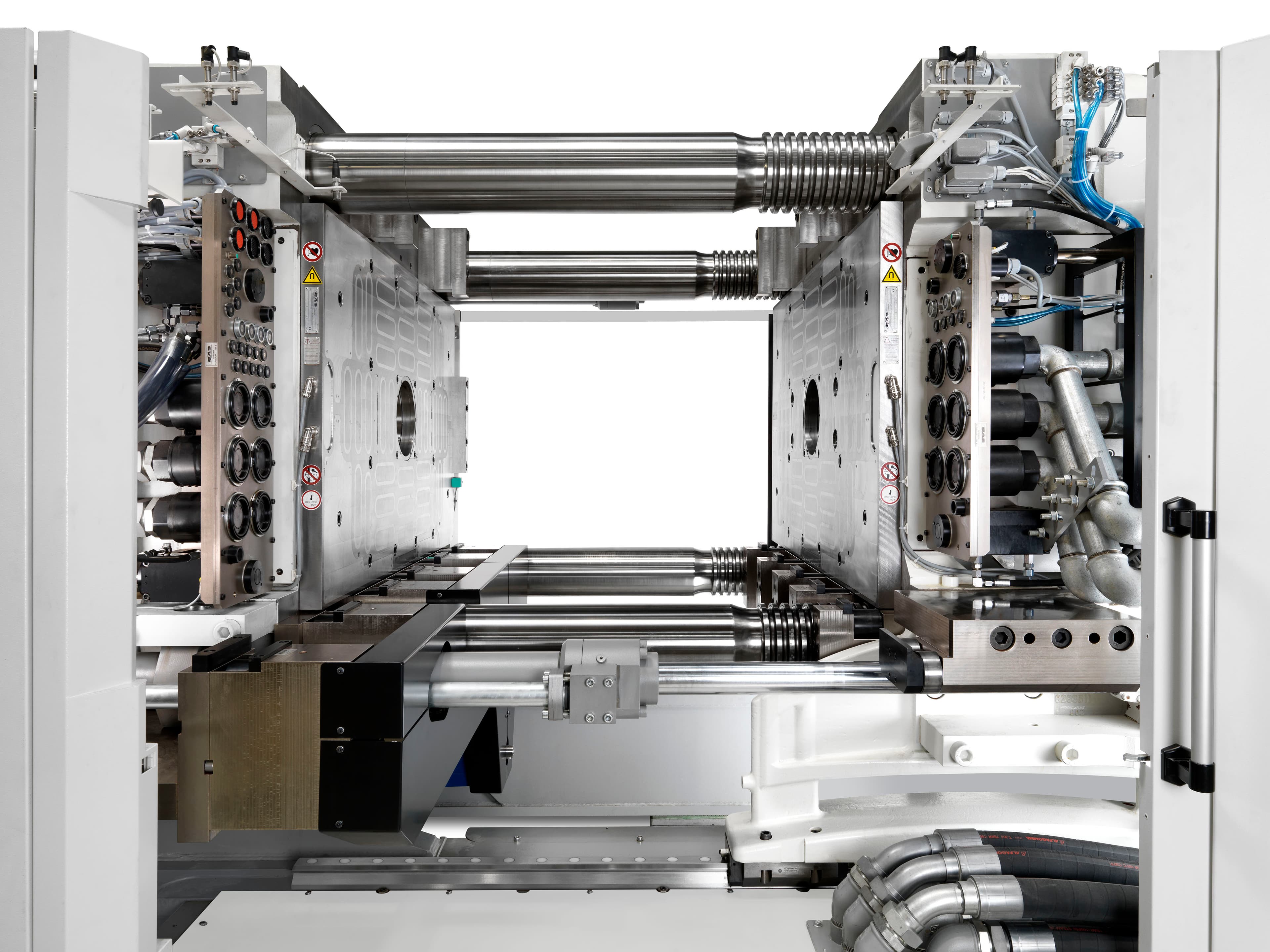 EAS Pressmag LP magnetic clamping system with hydraulic multicouplers installed on injection molding machine achieving sub-minute mold changes
